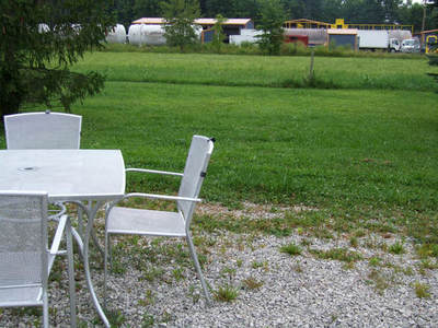 photo of patio set at heavy industrial fracking waste injection well operations in nearby Vienna, Ohio way too near a family home and community
