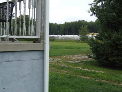 photo of front porch at heavy industrial fracking waste injection well operations in nearby Vienna, Ohio way too near a family home and community