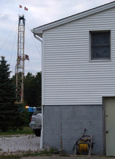 photo of home at heavy industrial fracking waste injection well operations in nearby Vienna, Ohio way too near a family home and community