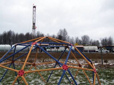 photo of playset at heavy industrial fracking waste injection well operations in nearby Vienna, Ohio way too near a family home and community